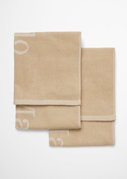 Towel Model Statement — Dark Sand