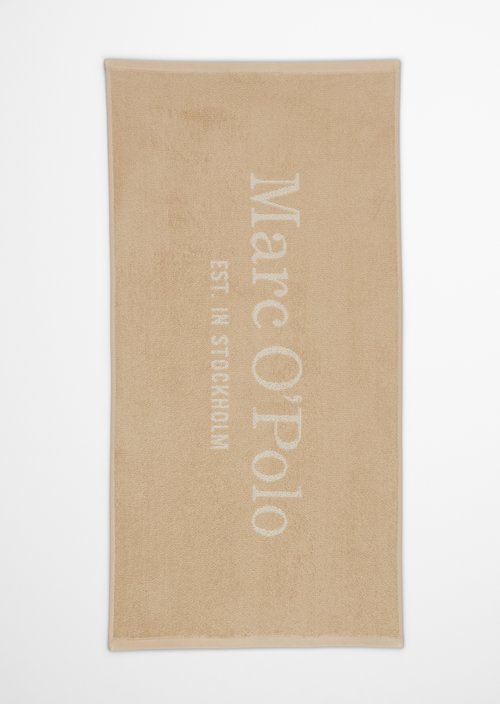 Towel Model Statement — Dark Sand