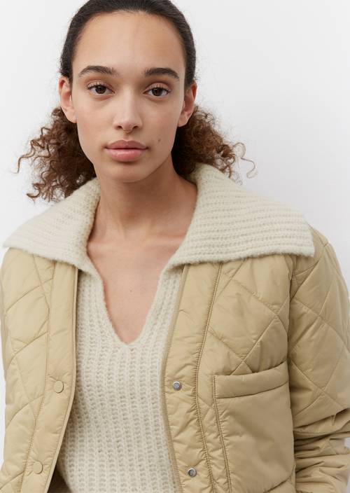 Quilted jacket in the style of a cardigan wheat field in detail view