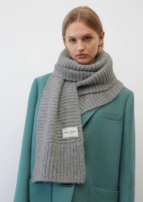 Chunky knit scarf shaded grey melange worn on model