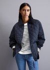 Relaxed quilted jacket with corduroy collar made from water Relaxed quilted jacket with corduroy collar made from water