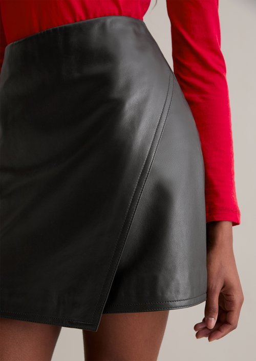 Flared leather mini skirt in a wrap style — Black