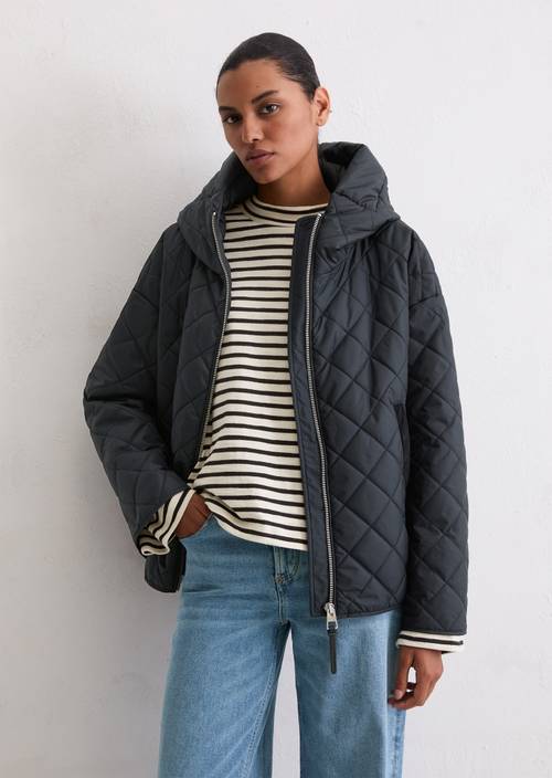 Relaxte gewatteerde jas met capuchon Deep Night Blue in vooraanzicht