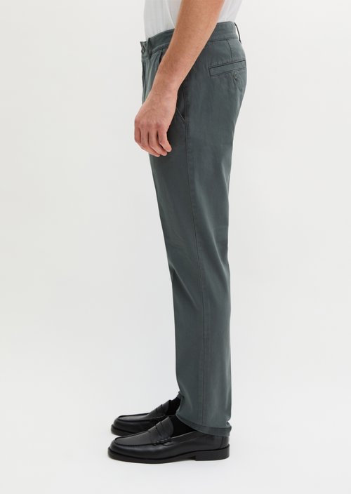 Chino model Stig shaped — Skipping Stone