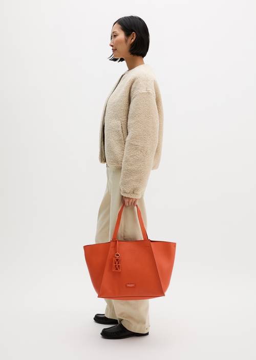 Biana Tote Bag Vivid Orange worn on model