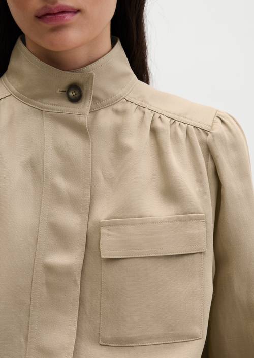Loose stand-up collar jacket Sandpaper in detail view
