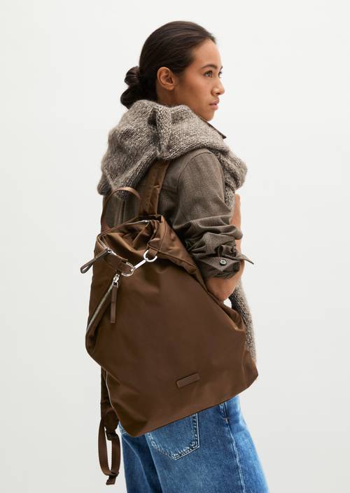 Alexa Medium Backpack Dark Walnut worn on model