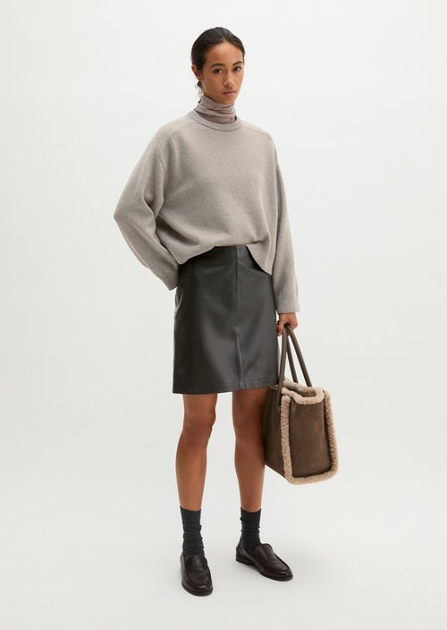 Flared leather miniskirt in a wrap style — Black