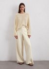 Oversized sweater made from fancy yarn - white | Knitted