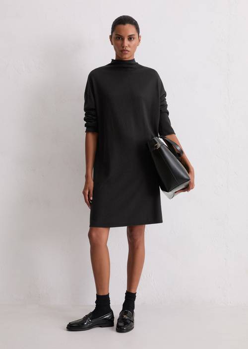Relaxed fine knit sweater dress made from a soft virgin wool blend