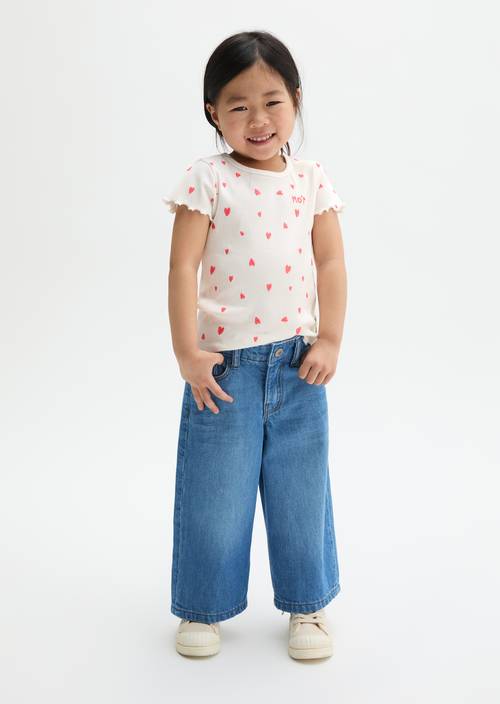 Jeans KIDS-GIRLS Mid Blue Denim porté sur le mannequin